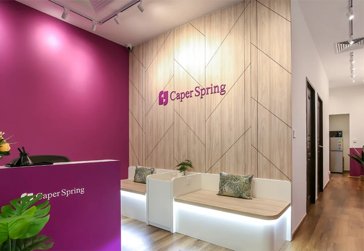 The Caper Spring counselling reception at City Gate, a calm magenta and timber waiting area