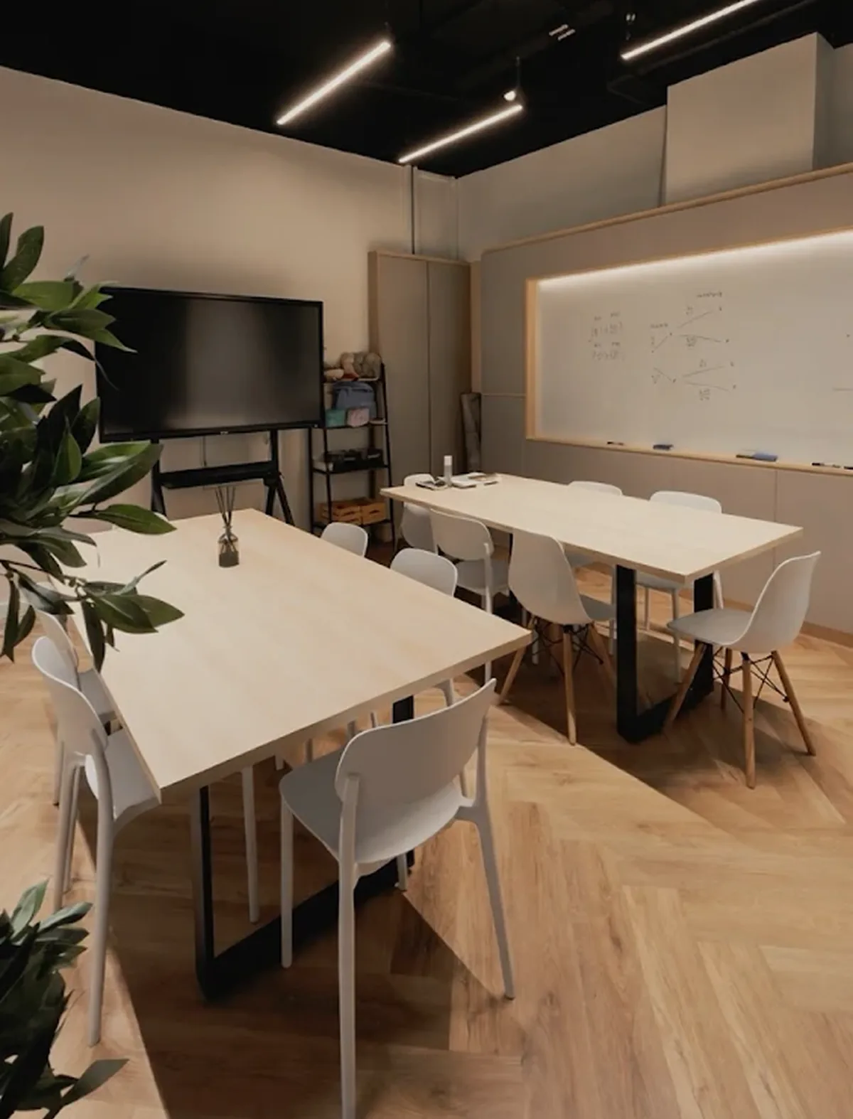 A bright tuition classroom at Puzzles Education Studio, City Gate, with study tables, chairs and a whiteboard