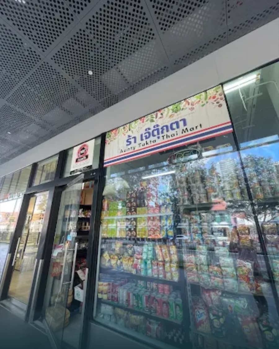 The Aunty Tukta Thai Mart storefront at City Gate, packed with Thai snacks and pantry goods