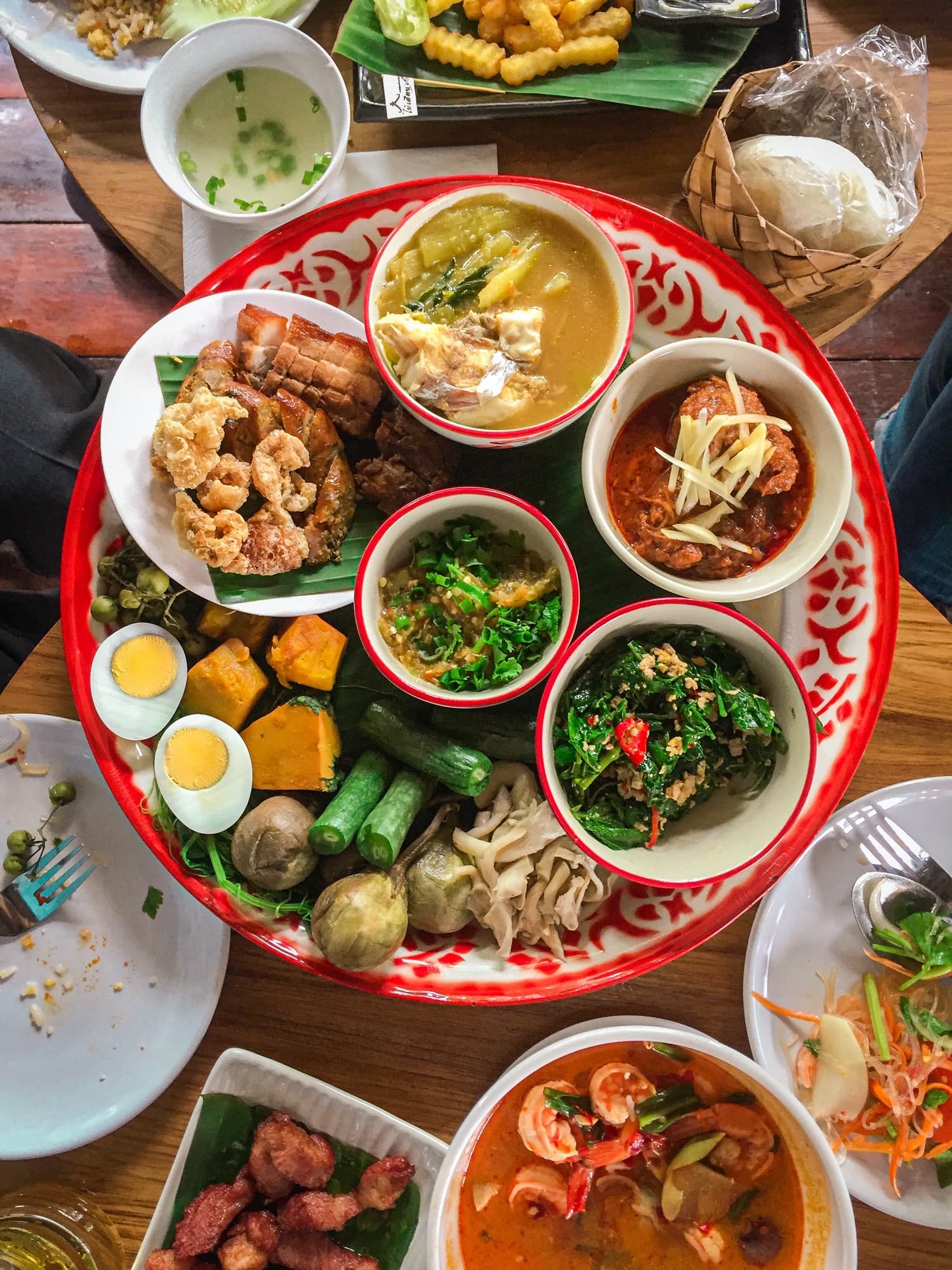 A Thai sharing platter of curries, larb, crispy pork and fresh vegetables at Diandin Leluk, City Gate