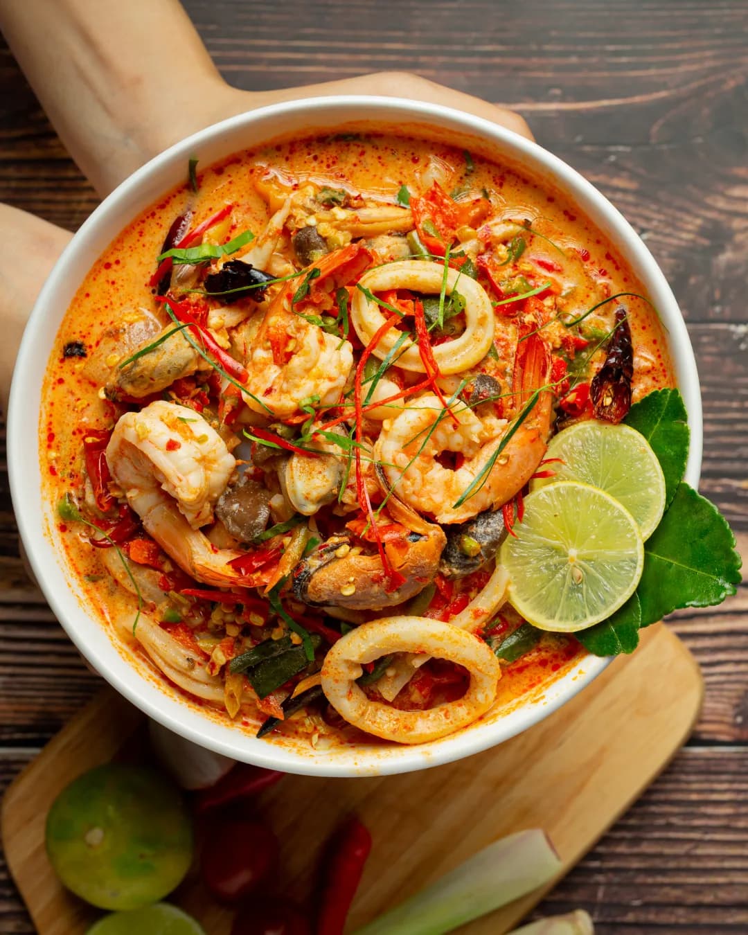 A bowl of creamy tom yum seafood with prawns, squid and lime — Thai flavours at City Gate