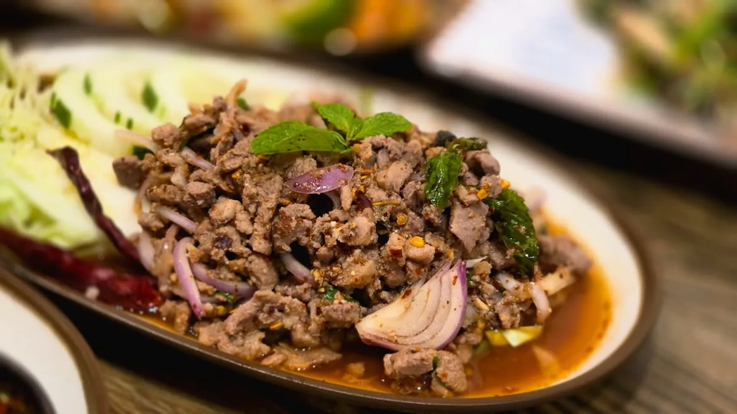 Northeastern Thai larb — minced meat with mint, red onion and toasted rice — at Ma Der Kin Khao, City Gate