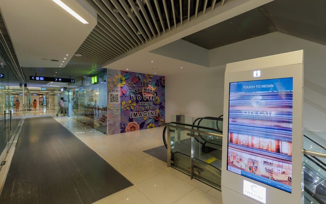 City Gate mall interior with the digital directory and escalators
