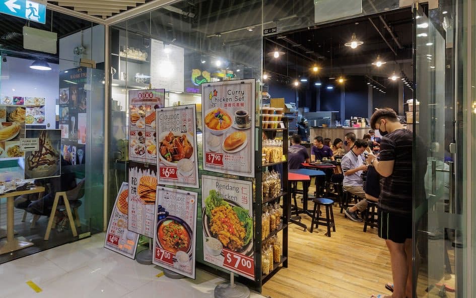 A busy F&B unit at City Gate with diners at the counter